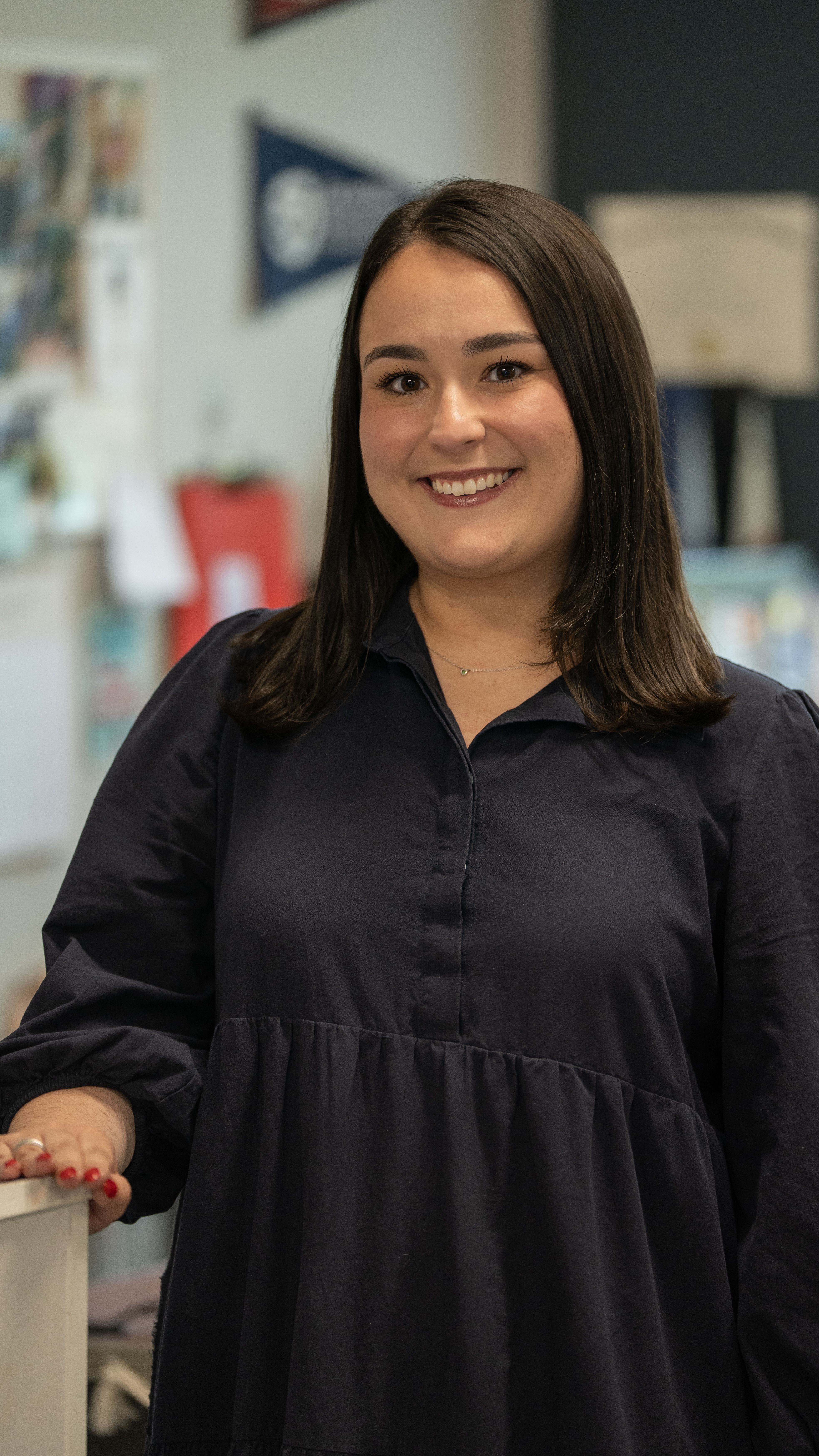 Gloria Masterton Hunter in dark shirt seated
