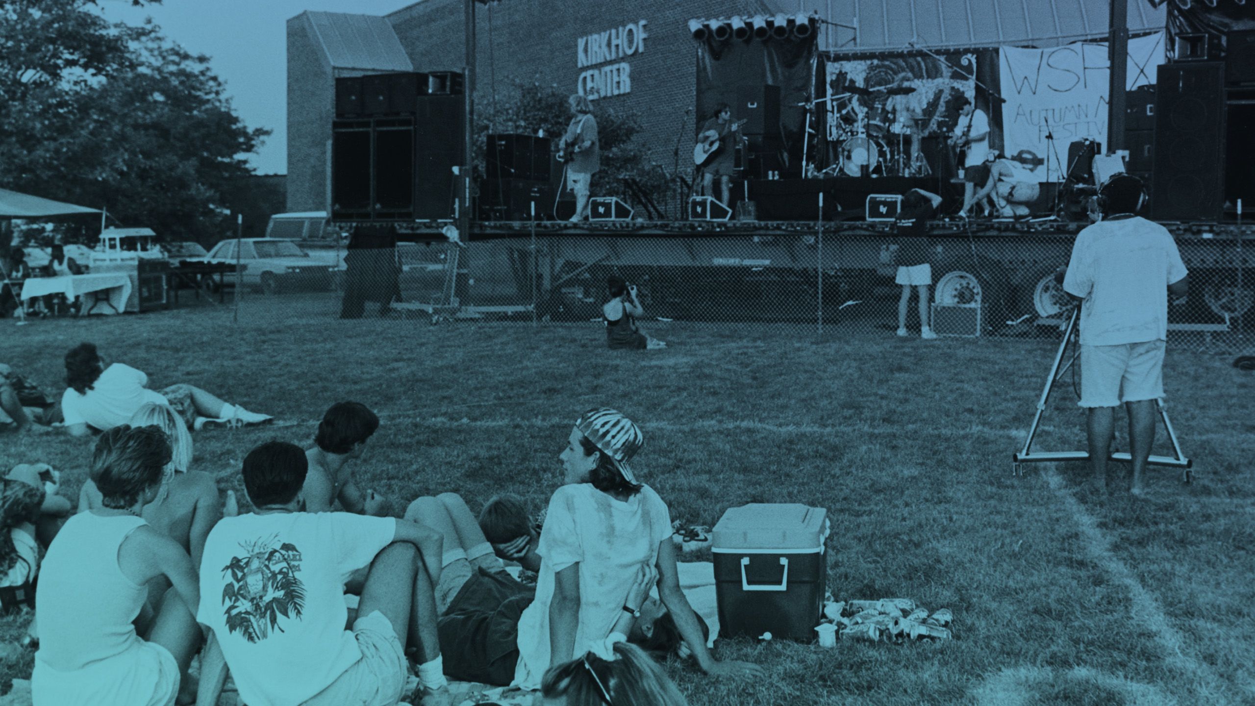 concert in front of Kirkhof Center, circa 1970s, students seated on grass in front