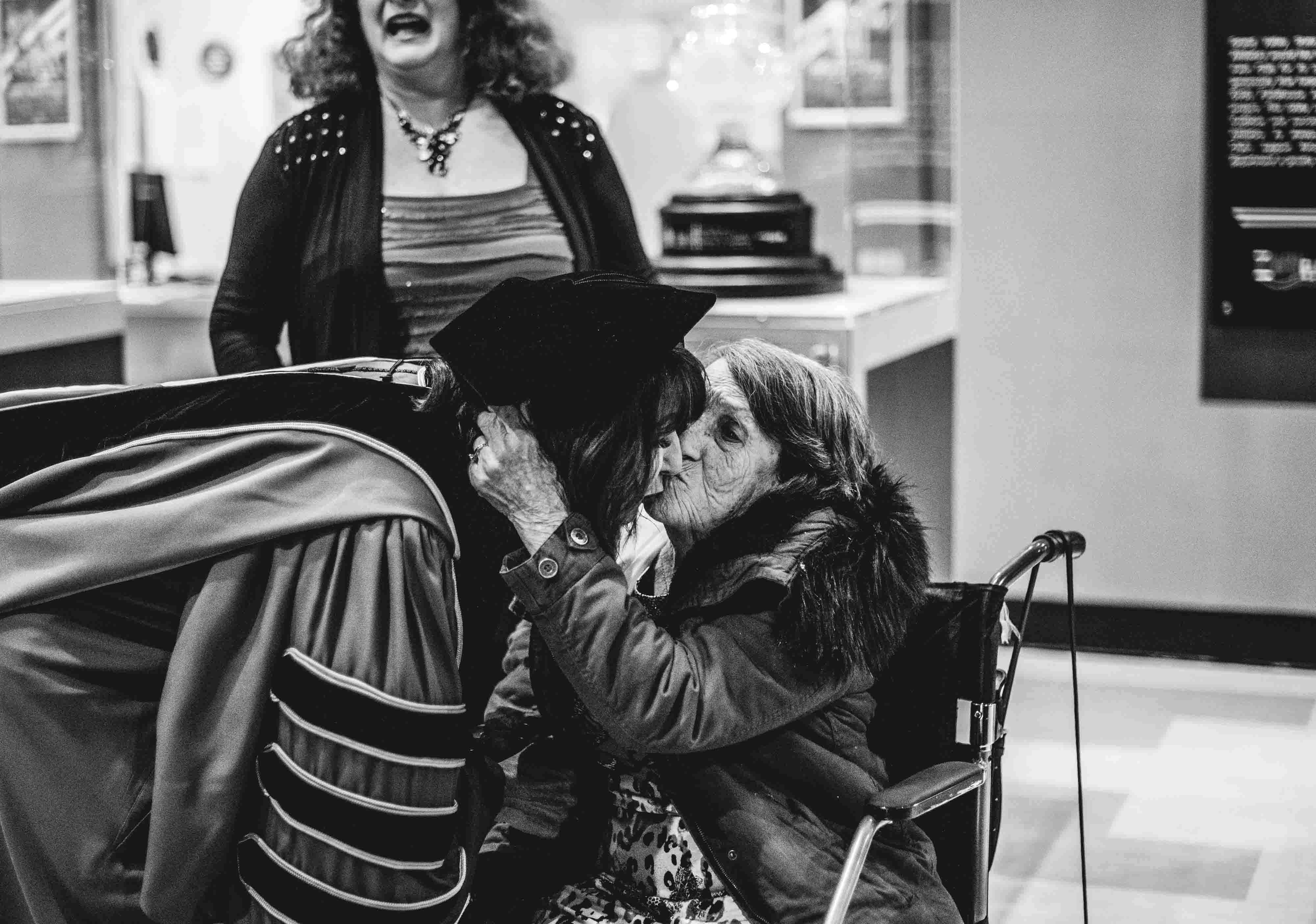President Philomena V. Mantella kisses her mother, Lucille Mantella, at the 2019 investiture ceremony.