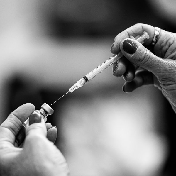 Needle and vaccine vile.