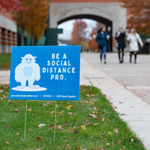 A sign on the Allendale Campus about social distancing.