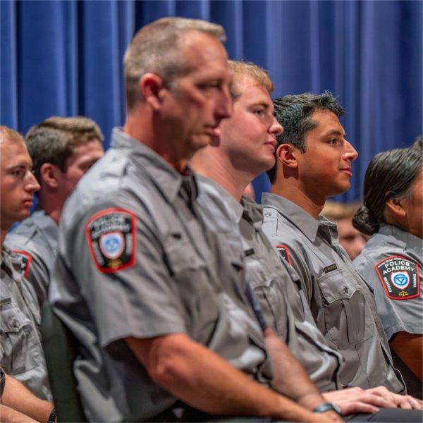 Police academy graduates take part in the Police Academy Graduation Ceremony at the Louis Armstrong Theatre on August 21.