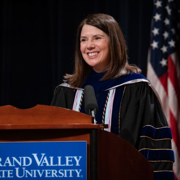 Provost Maria Cimitile at podium in academic regalia