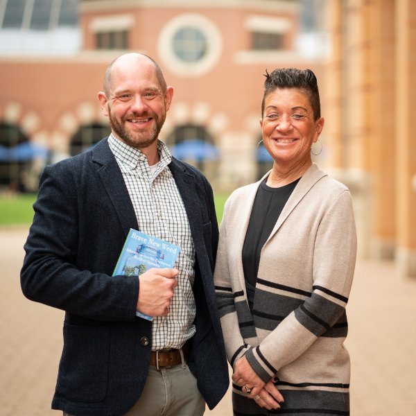 Professors John Lipford and Kristen Jack pose for a photo