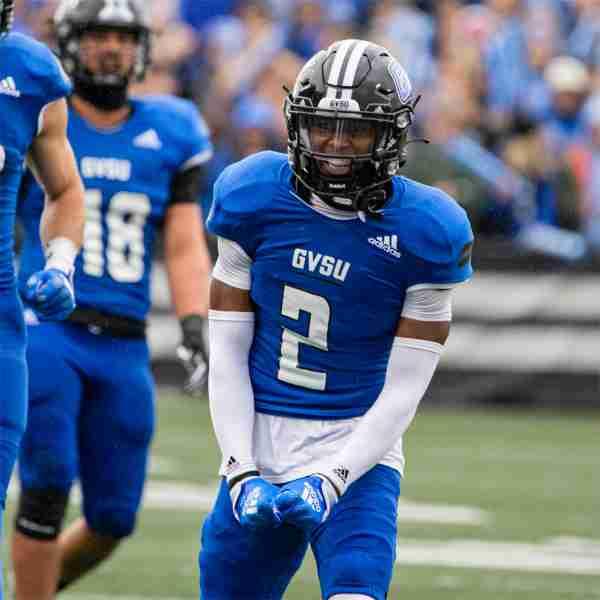 Grand Valley football player flexes after making a play