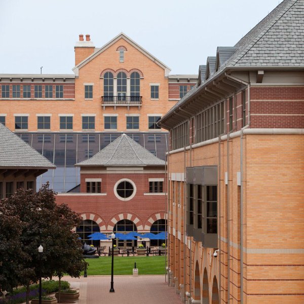 exterior view of the DeVos Center, with green grass in the center