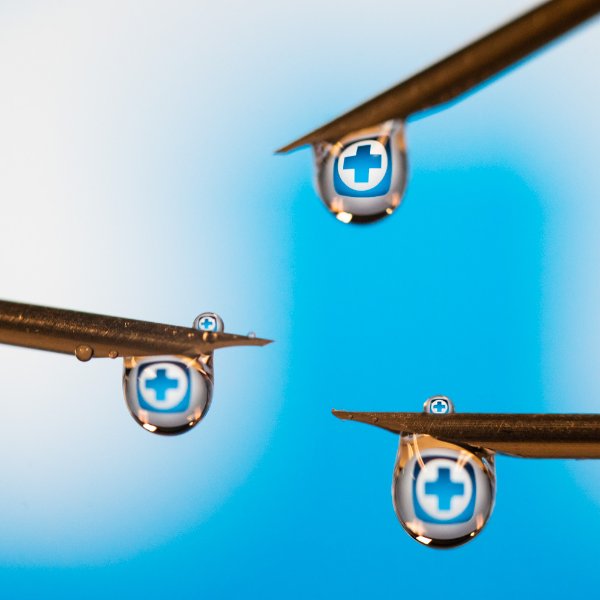 Needles with droplets coming off of them.