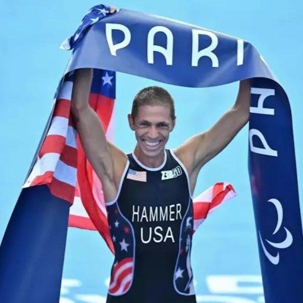 Chris Hammer celebrates his gold medal in the triathlon at the Paris Paralympic Games