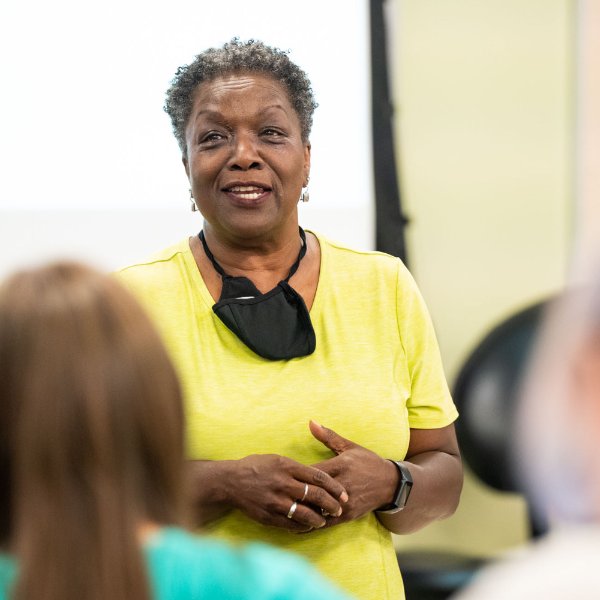 Faye Richardson-Green speaks with students during her honors seminar class.