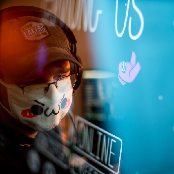 A portrait of a person playing a video game.