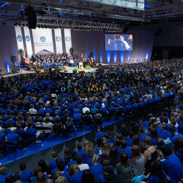 A wide-angle, crowd shot of a Grand Valley State University Convocation ceremony.