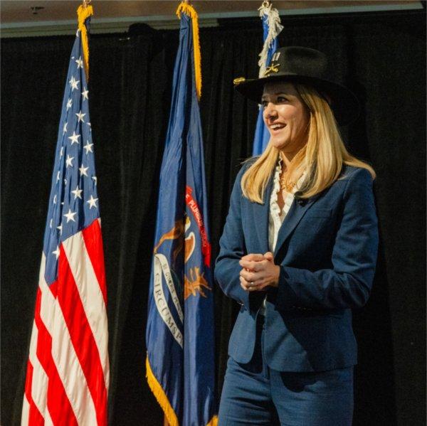Ingrid Tighe speaks in front of the attendees of the luncheon