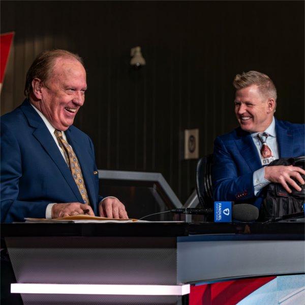 John Keating on stage with broadcast partner Chris Osgood