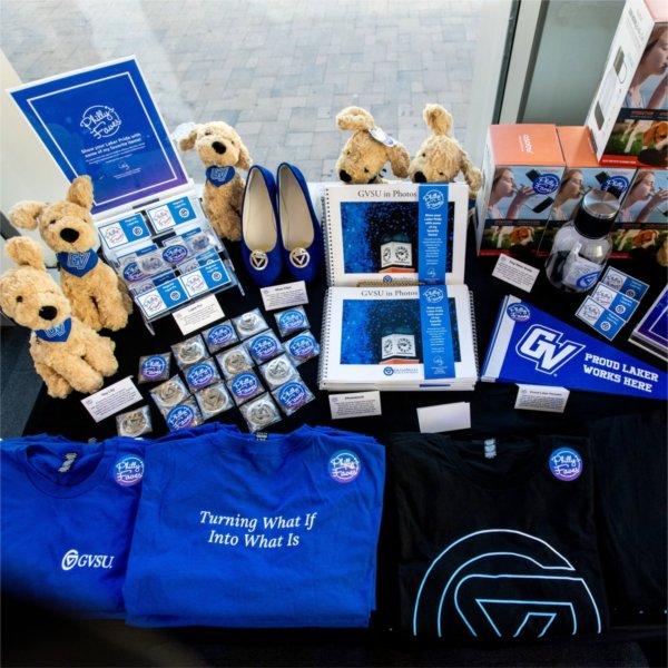 table of Philly's Faves products, plush dogs, t-shirts, lapel pins, pennants and a photo book