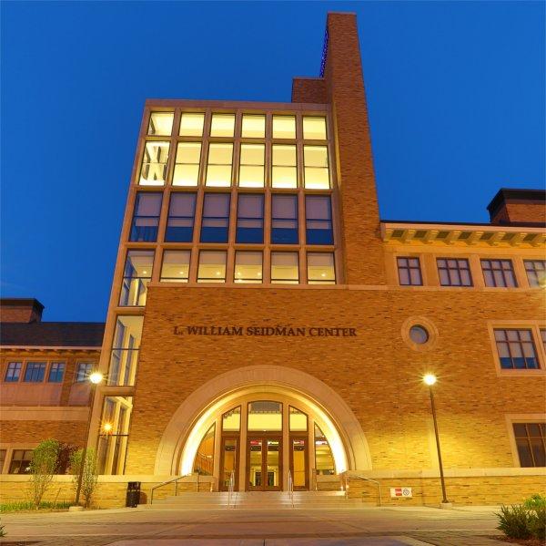 Exterior view of the L. William Seidman Center at dusk