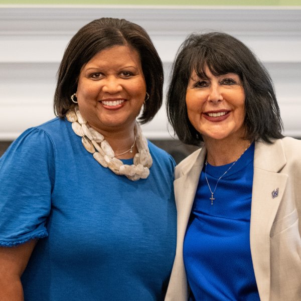 Tia Brown McNair and President Philomena V. Mantella pose for a photo