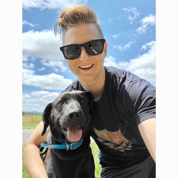 GVPD Officer Kelsey Sietsema and a 2-year-old black Labrador Retriever.