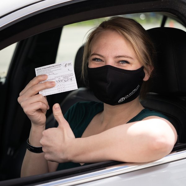 Veteran gives a thumbs up after receiving vaccine.