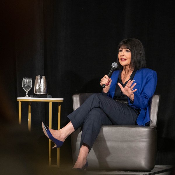 President Philomena V. Mantella answers a question during a panel discussion at the Economic Club of Grand Rapids.
