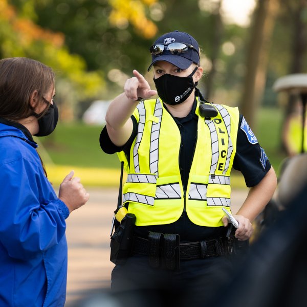 A GVPD officer directs a person during move-in