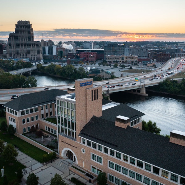 Drone photo of sunrise behind of Seidman College of Business