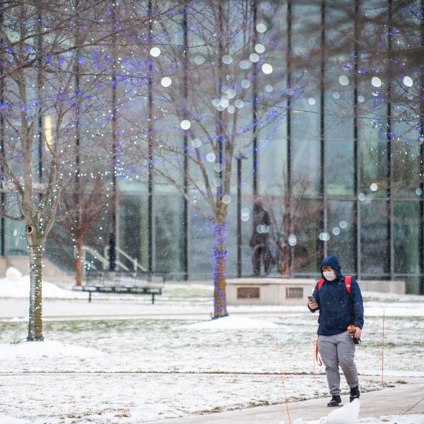 Student walking on campus.