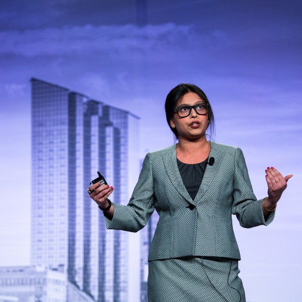 Seidman College of Business building with sun behind it