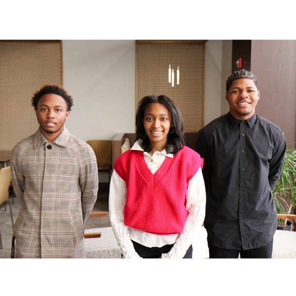 Three students standing in office setting, from left, Kamarion Craig, Nadia Miller and Darian Quinn