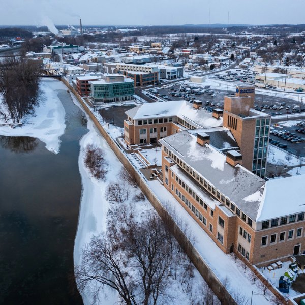aerial view, snowy, of Seidman Center next to Grand River.