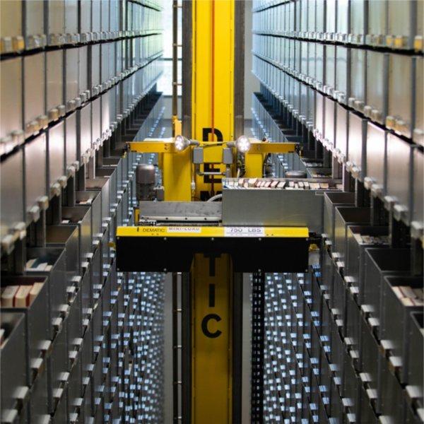 The Dematic ASRS crane retrieves a box storing books.