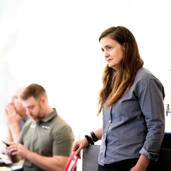 Jill Hinton Wolfe, GVSU's military and veterans resource manager, listens to student veterans that worked with the ATOMA Veteran Mental Health Project that was discussed during a GVSU Laker Veterans luncheon.