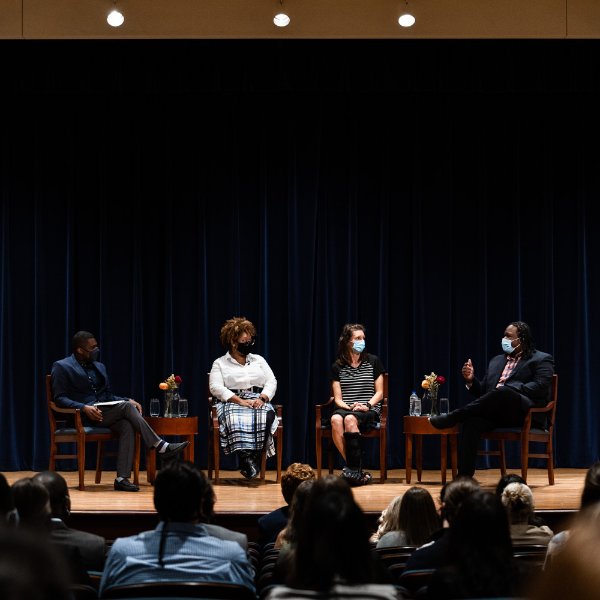 Panelists discussing topic at Loosemore Auditorium