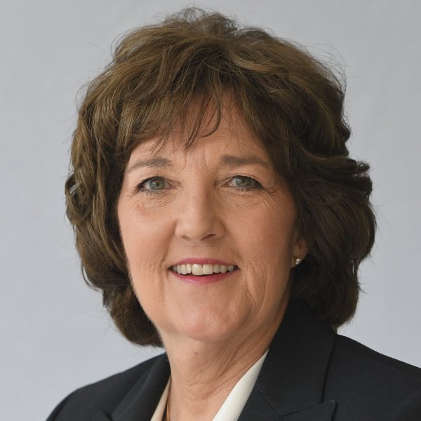 headshot of Patricia Thomas in white shirt and dark blazer