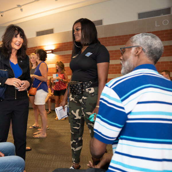 President Mantella greets students and parents at orientation on July 15.
