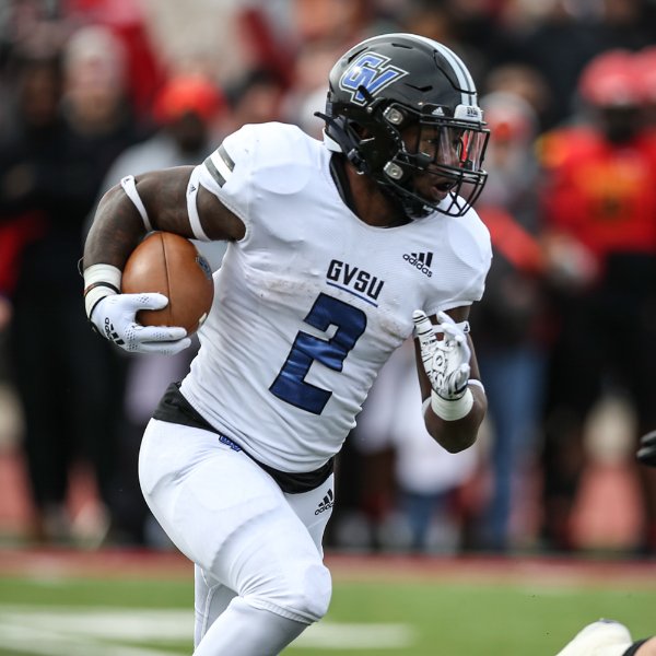 Running back Tariq Reid carries the ball in a game against Ferris State