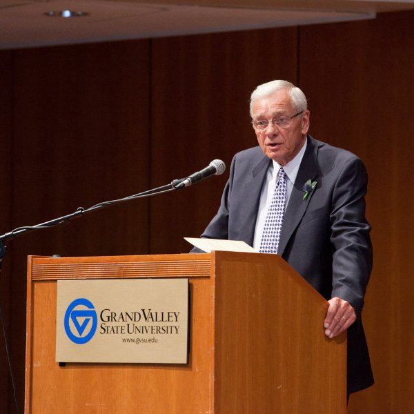 Glenn A. Niemeyer speaks from behind a podium while standing