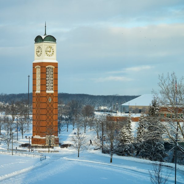 Grand Valley Allendale Campus in the winter with carillon in foreground.