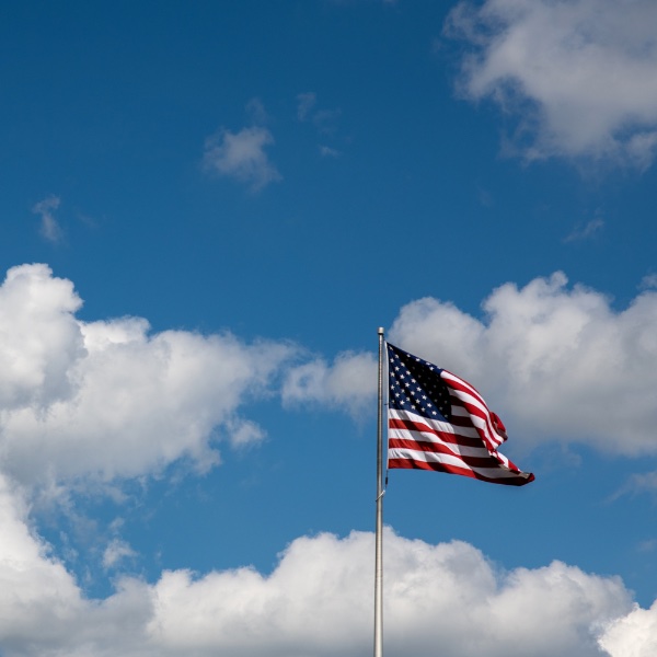 American flag flying over GVSU campus