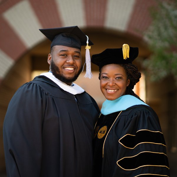 photo of Cordell Zachery and his mother, Alena Zachery-Ross, both in academic regalia
