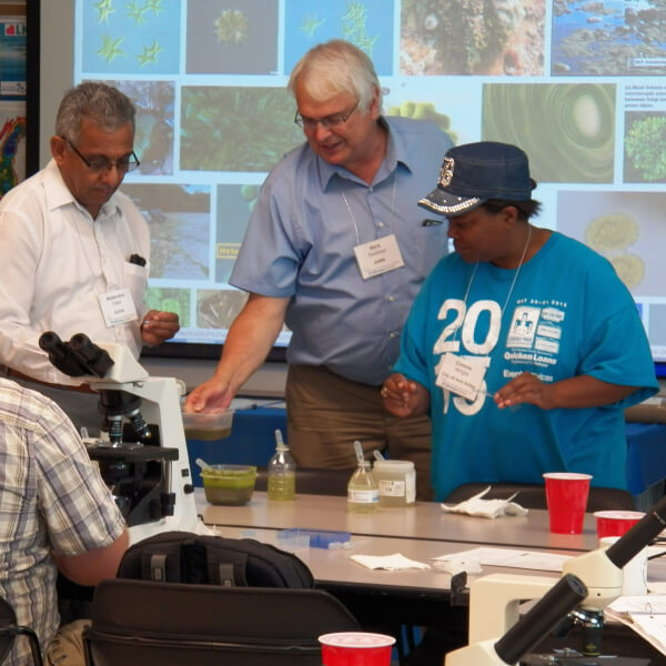 Rick Rediske teaches water treatment workers about algae.