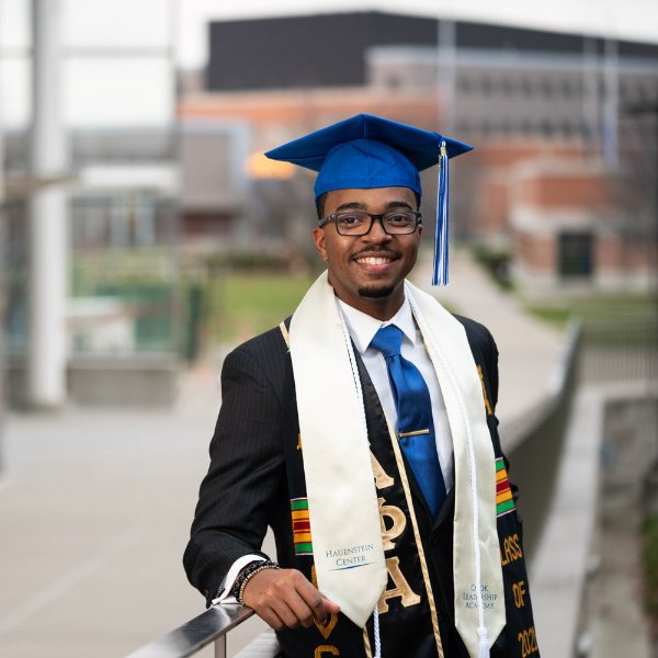Julian Sanders poses in graduation regalia.