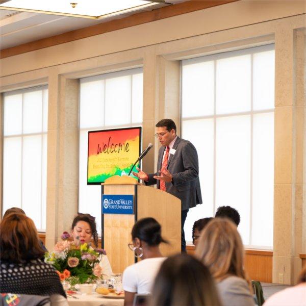 Jesse Bernal, vice president for inclusion and equity, addresses the crowd at the 2023 Juneteenth event.