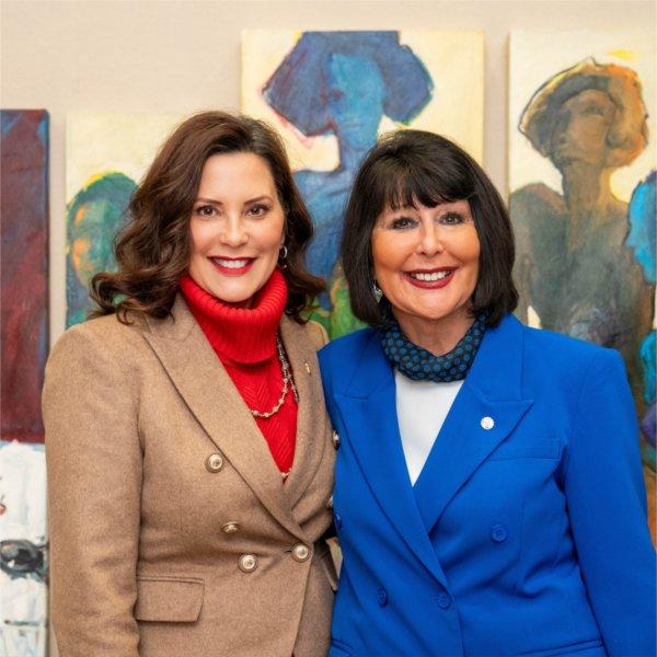Governor Gretchen Whitmer and Grand Valley President Philomena V. Mantella smile for a photo.
