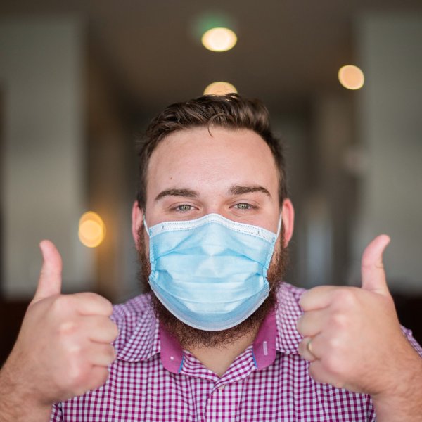 Man properly wearing a face covering.