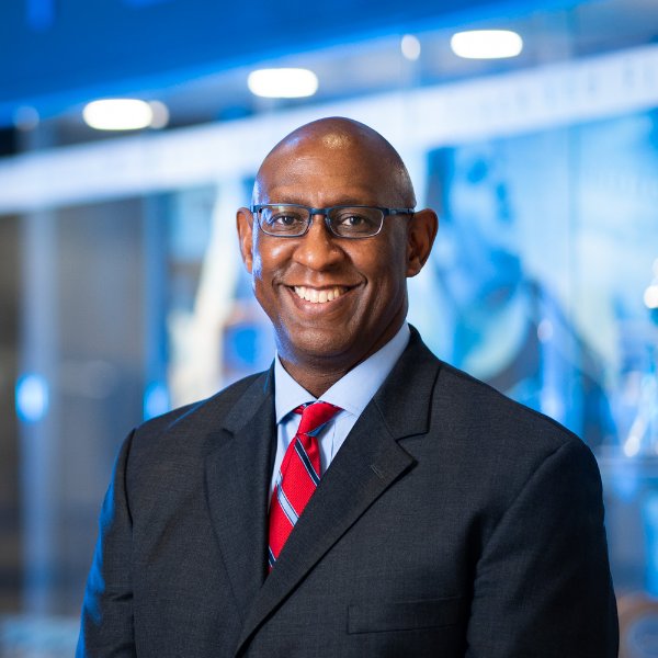 Walter Moore associate director of athletics for student athlete welfare and development, smiles for a photo