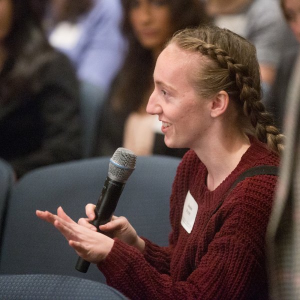 Student asking a question during Hauenstein Center event.