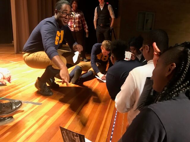 Darius Colquitt, who portrays Willis Ward, and Jesse Aukeman, who portrays Gerald R. Ford, interact with students after a performance at Spain Elementary-Middle School in Detroit.