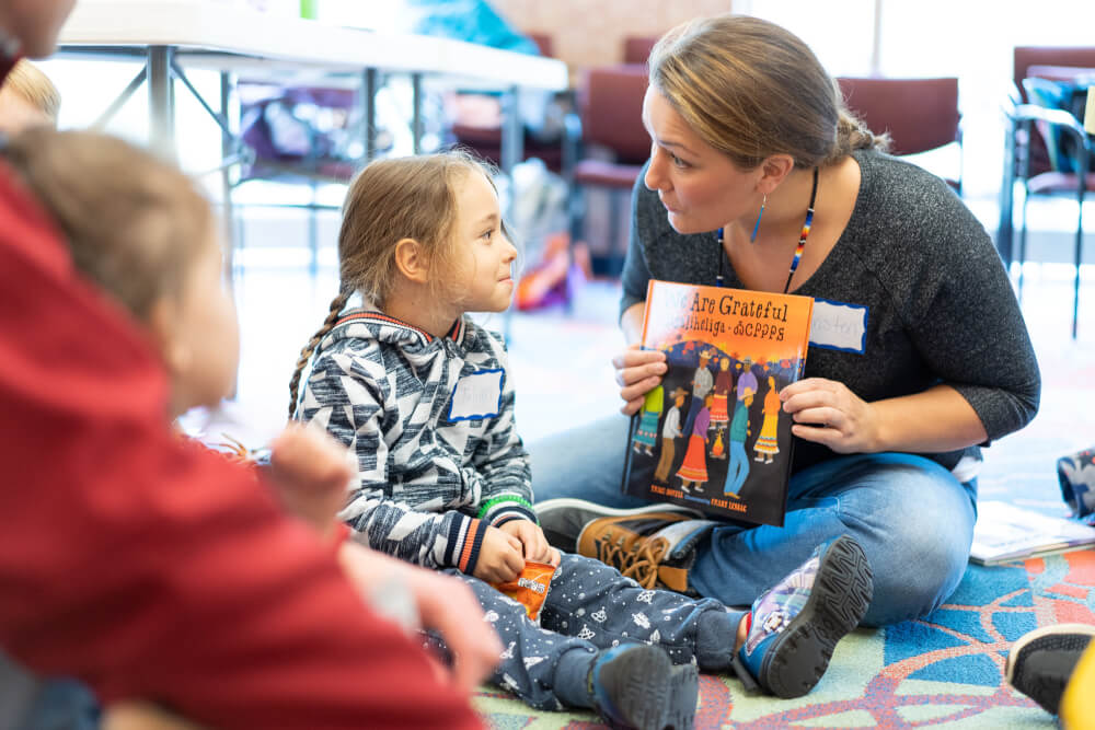 Children listen to stories with the theme, First Nations Peoples, at the Social Justice Begins With Me book club at the Grand Rapids Public Library.