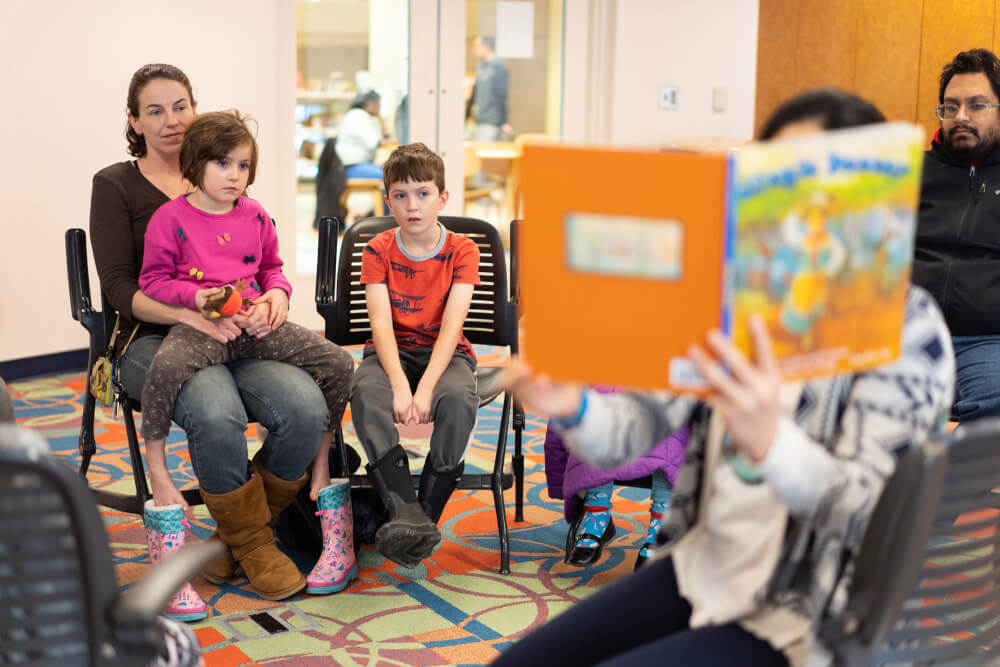 Children listen to stories with the theme, First Nations Peoples, at the Social Justice Begins With Me book club at the Grand Rapids Public Library.