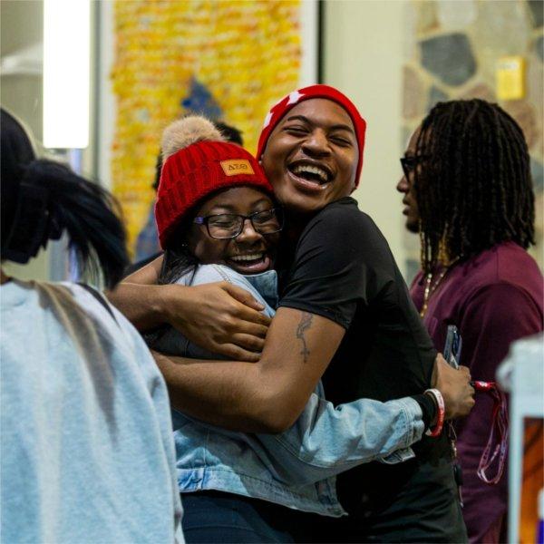 Two students hug during the Blackout event.